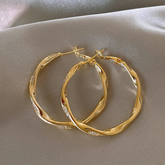 EA2487金色微鑲波紋圓圈耳環2026.04